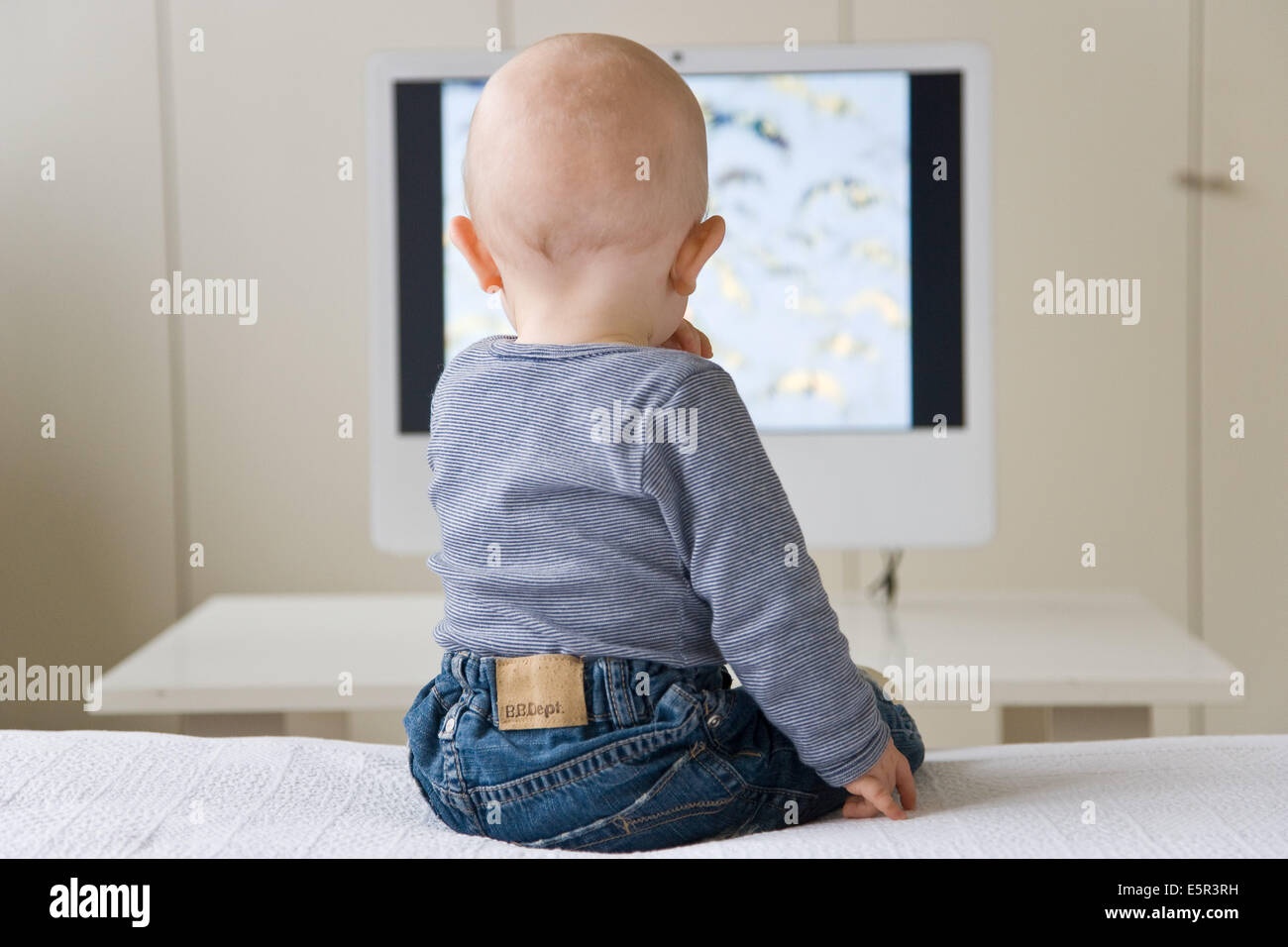 9 month old baby watching television Stock Photo Alamy