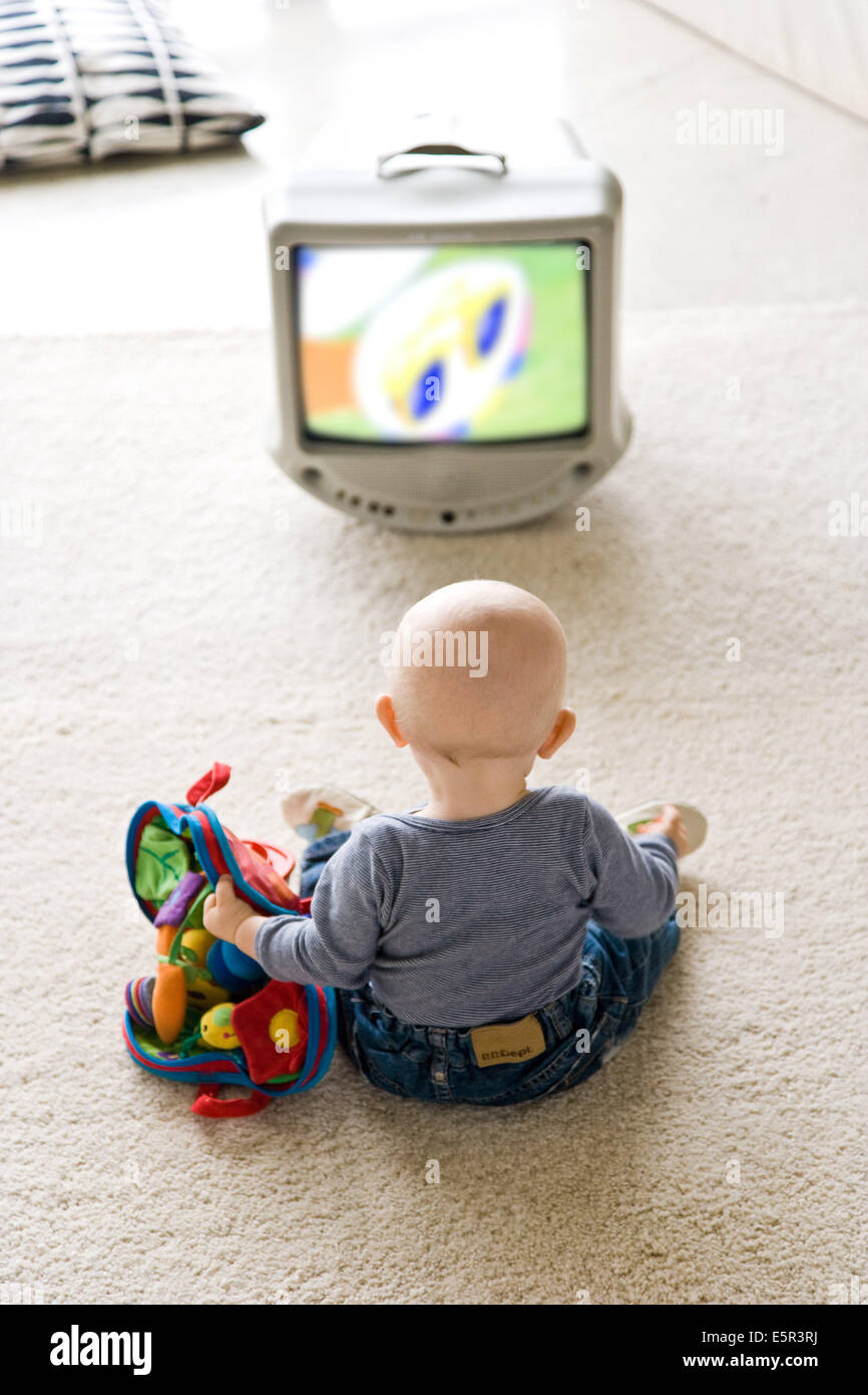 9 month old baby watching television Stock Photo Alamy