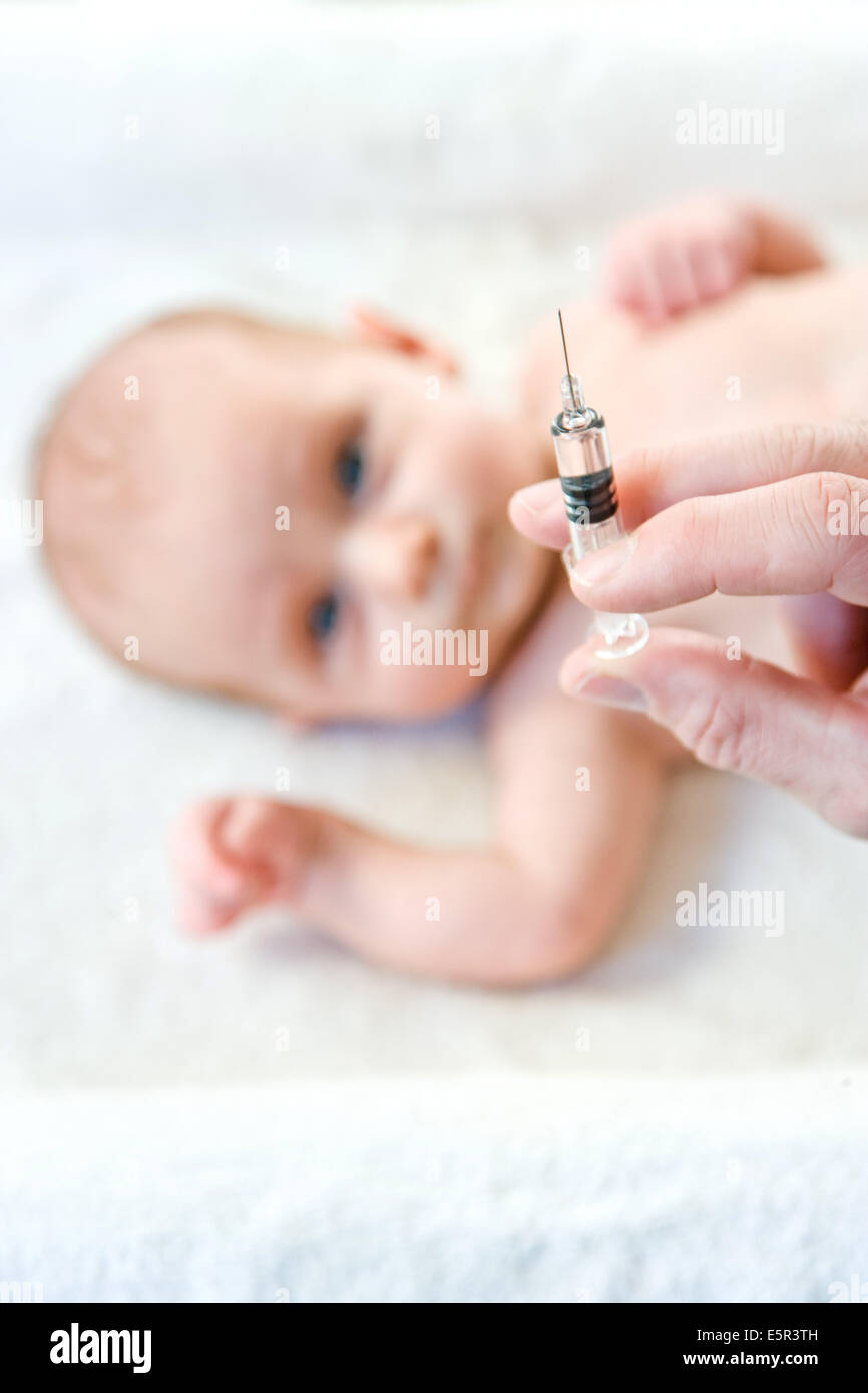 2 month old baby receiving vaccination Stock Photo - Alamy
