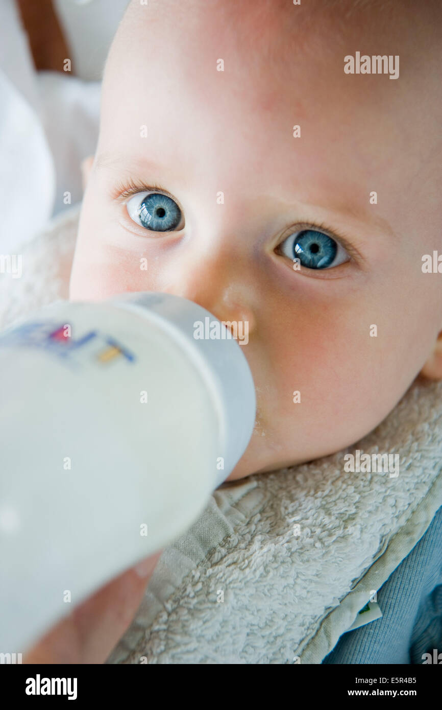9 month old baby with bottle Stock Photo Alamy