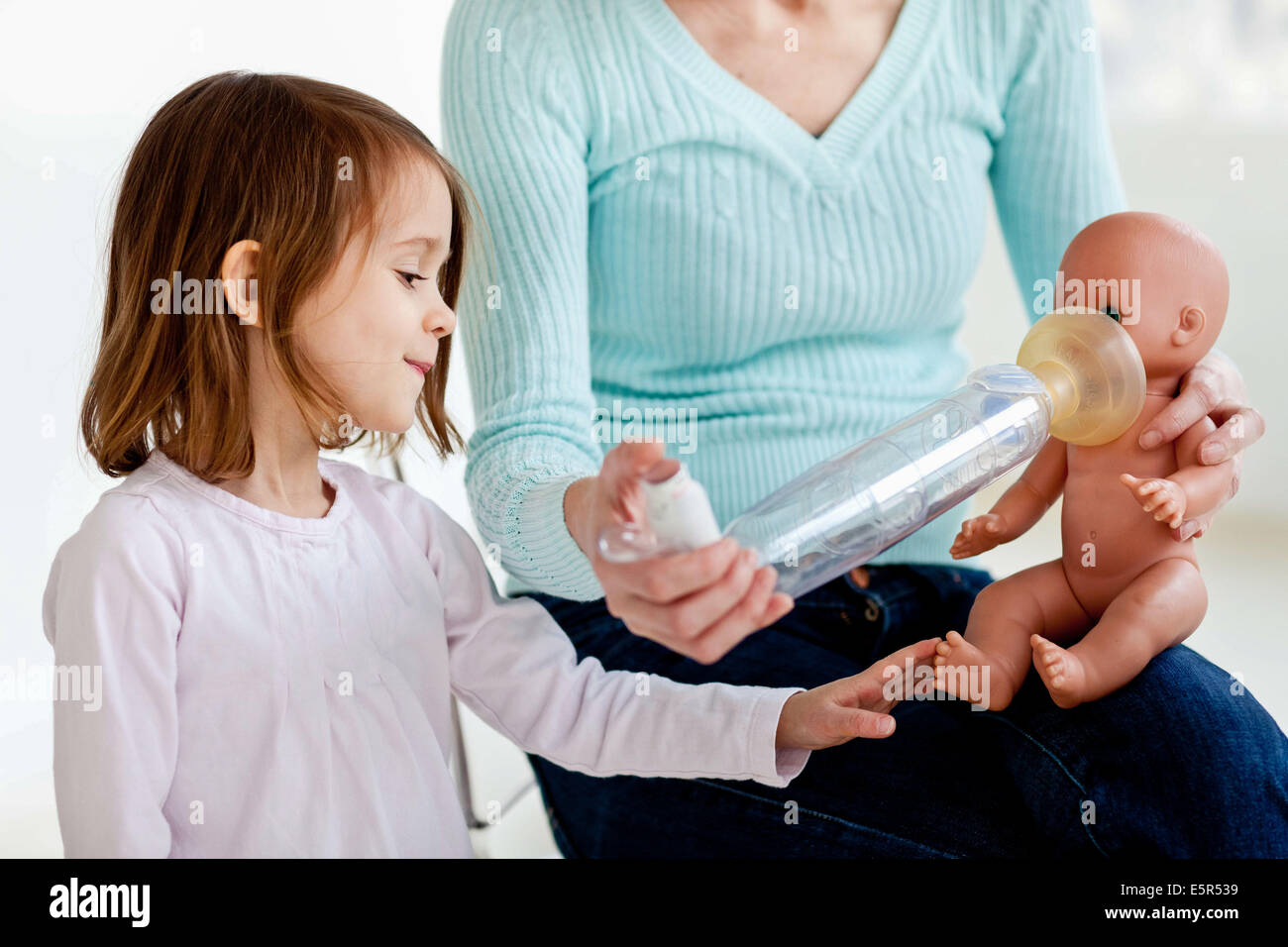 3yearold girl using an aerosol inhaler that contains bronchodilator
