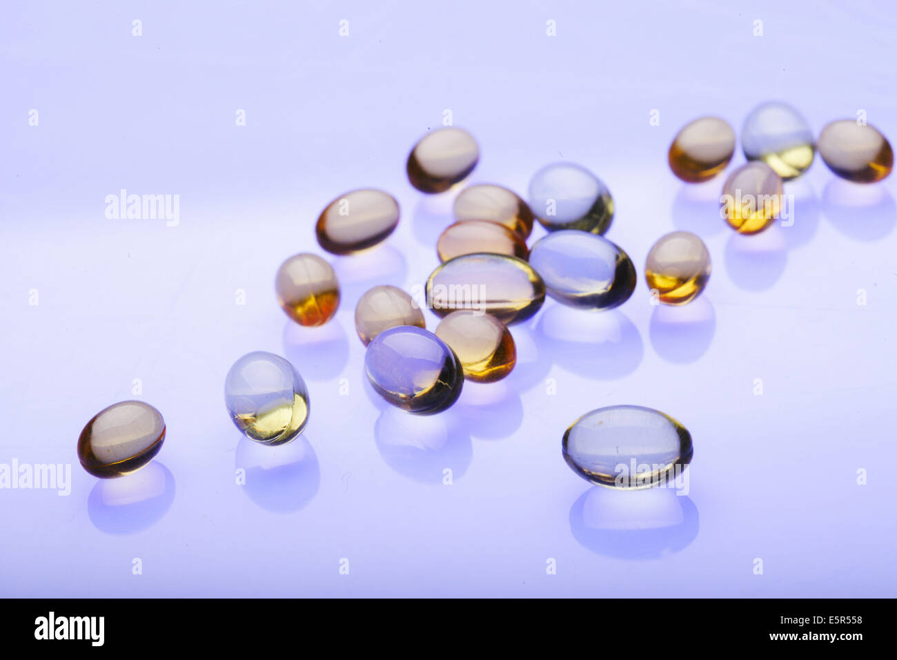 Fish oil gelatine capsule and vitamin Stock Photo Alamy