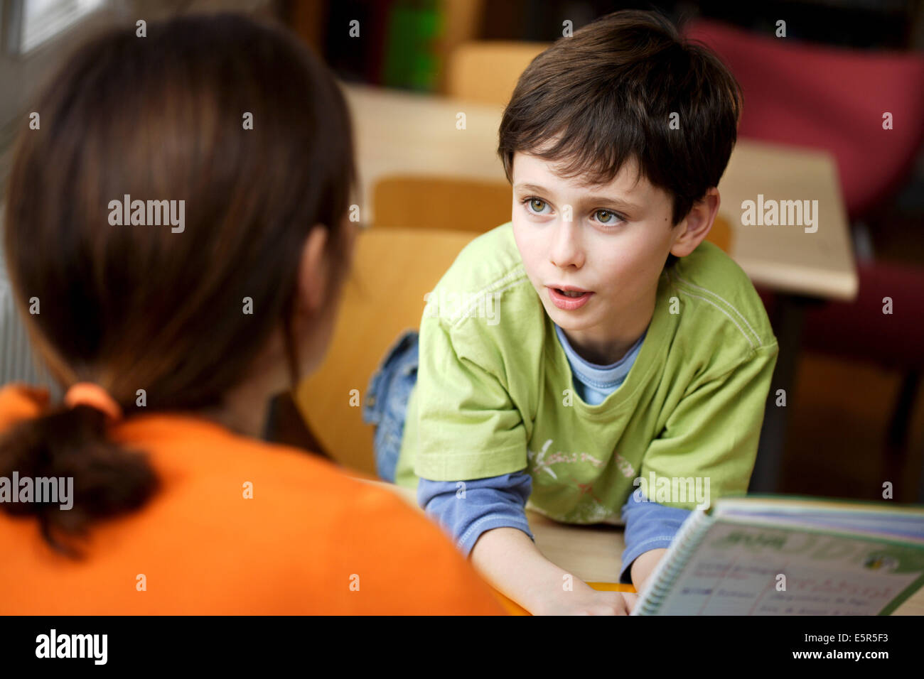 Woman talking with a 8 year old boy Stock Photo Alamy