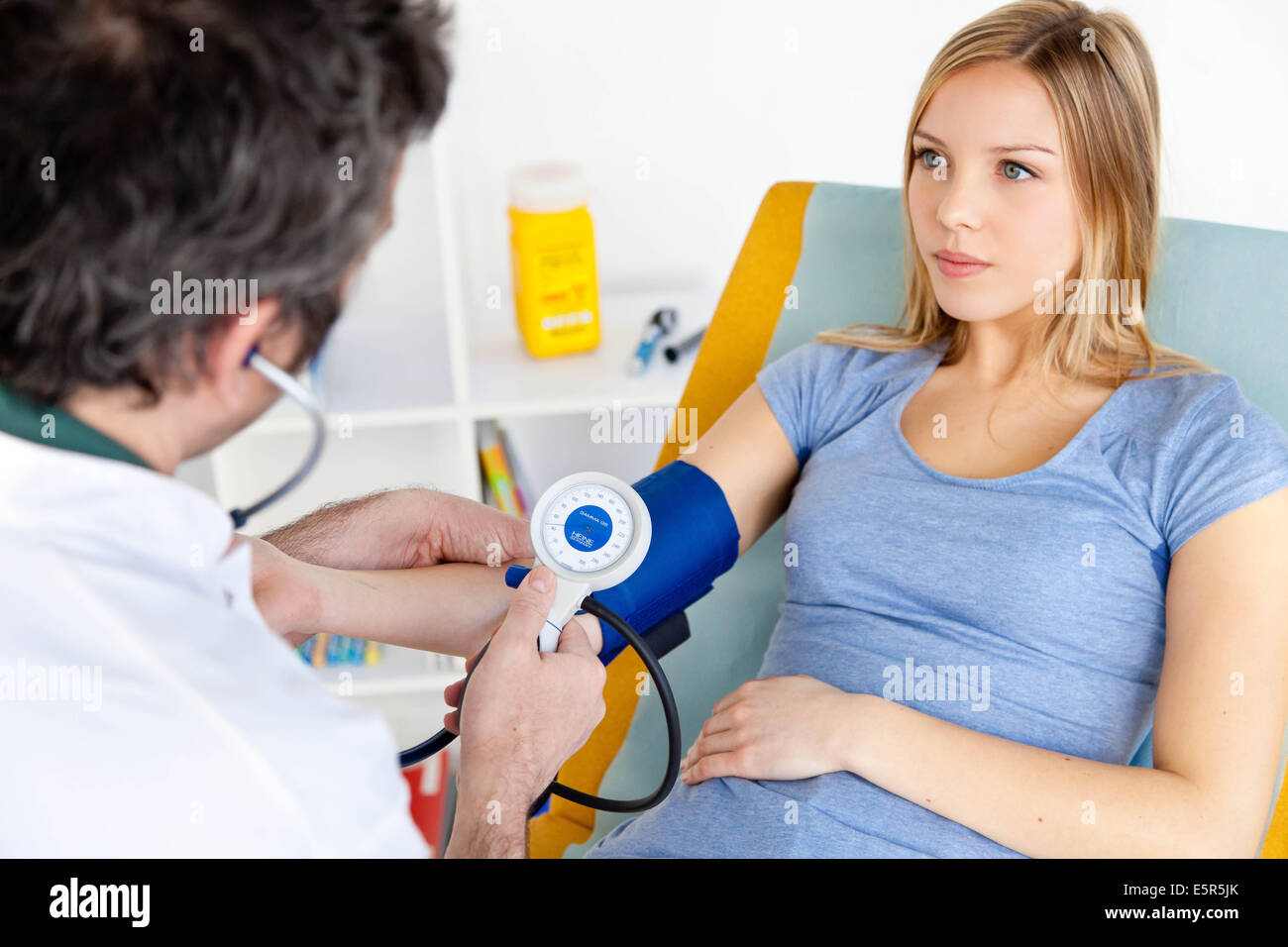 Checking blood pressure Stock Photo Alamy