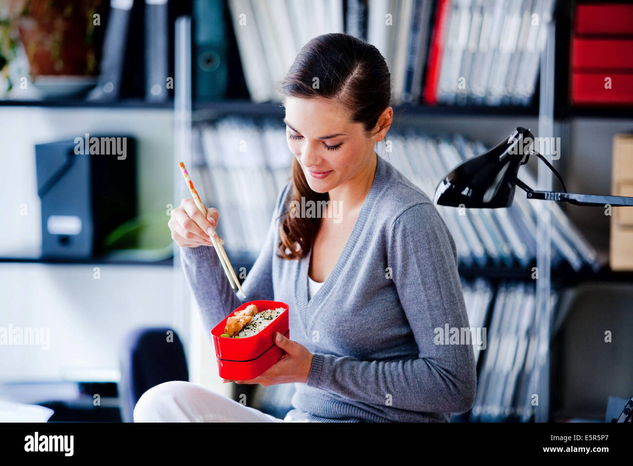 Woman eating bento. Stock Photo