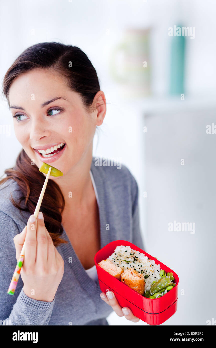 Woman eating bento. Stock Photo