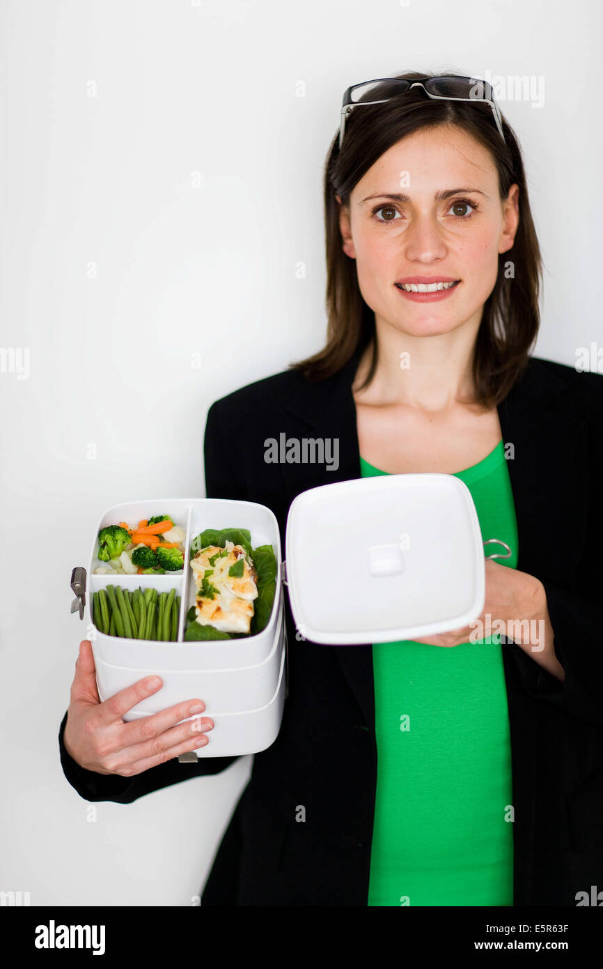 Business woman with lunch box Stock Photo - Alamy