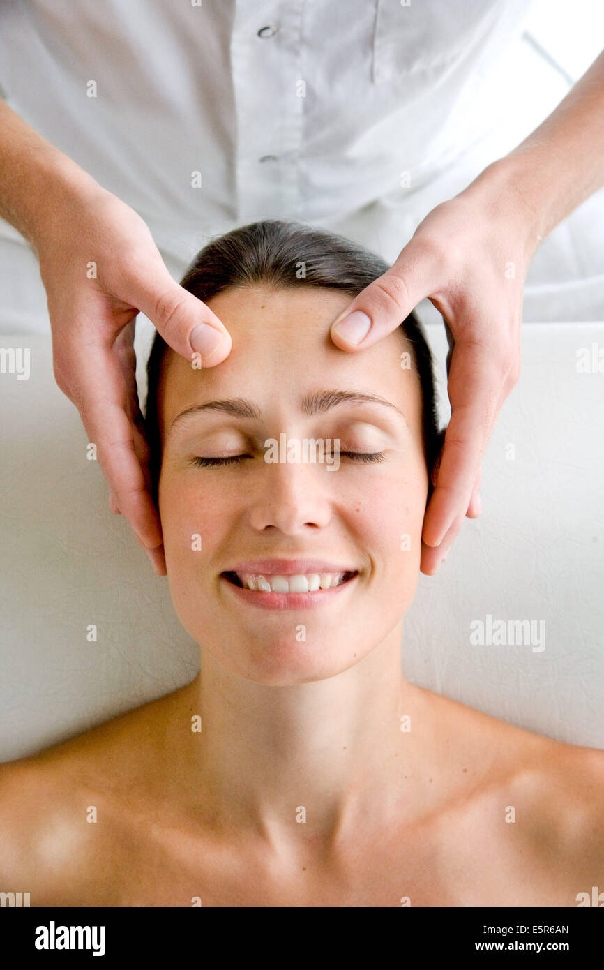 Woman receiving a face acupressure massage Stock Photo Alamy