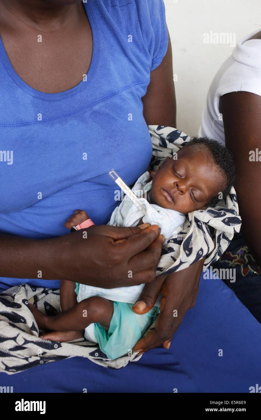 Checking the temperature of children suffering from malnutrition in a