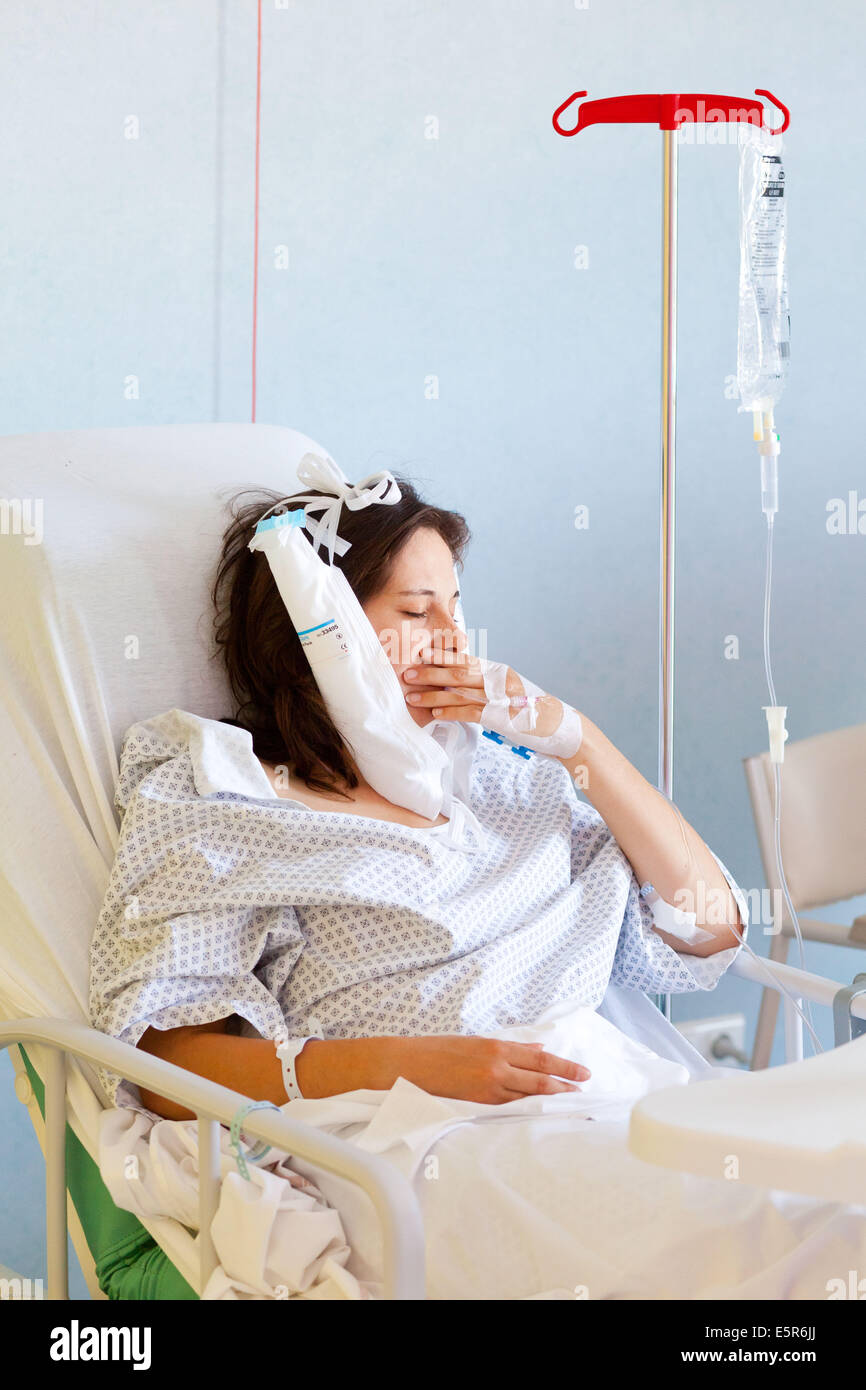 Female patient after wisdom tooth surgery, Day care surgery Unit