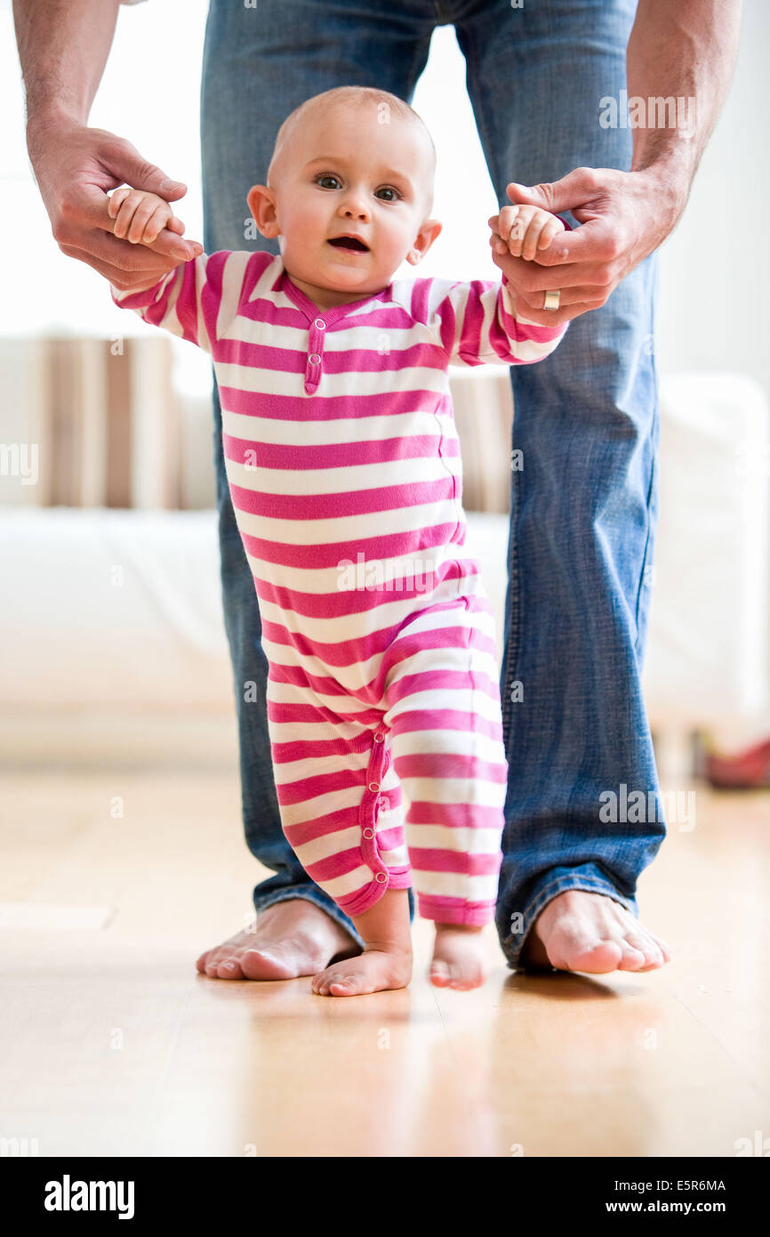 baby taking first steps