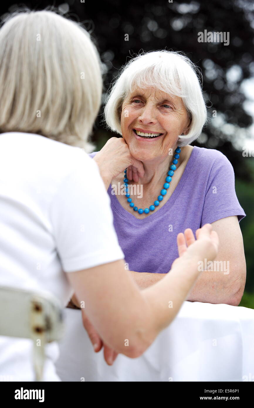 80 year old woman talking with her daughter. Stock Photo