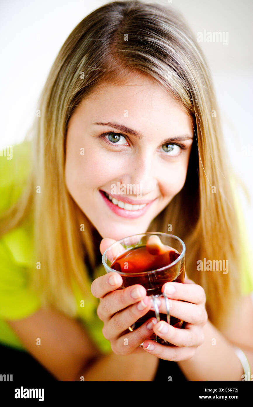 Woman drinking hot beverage Stock Photo Alamy