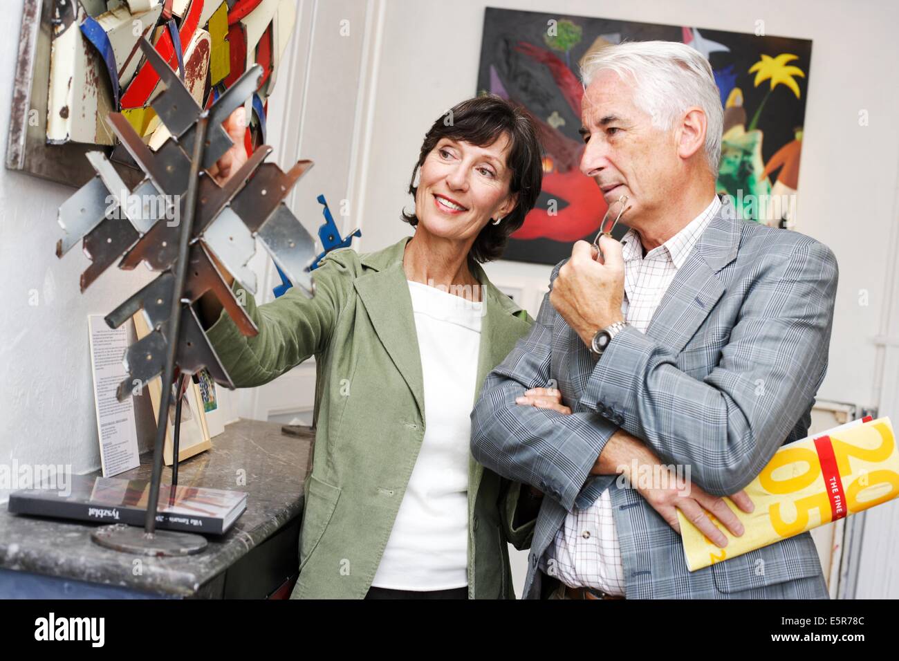 Senior couple visiting modern art gallery. Stock Photo