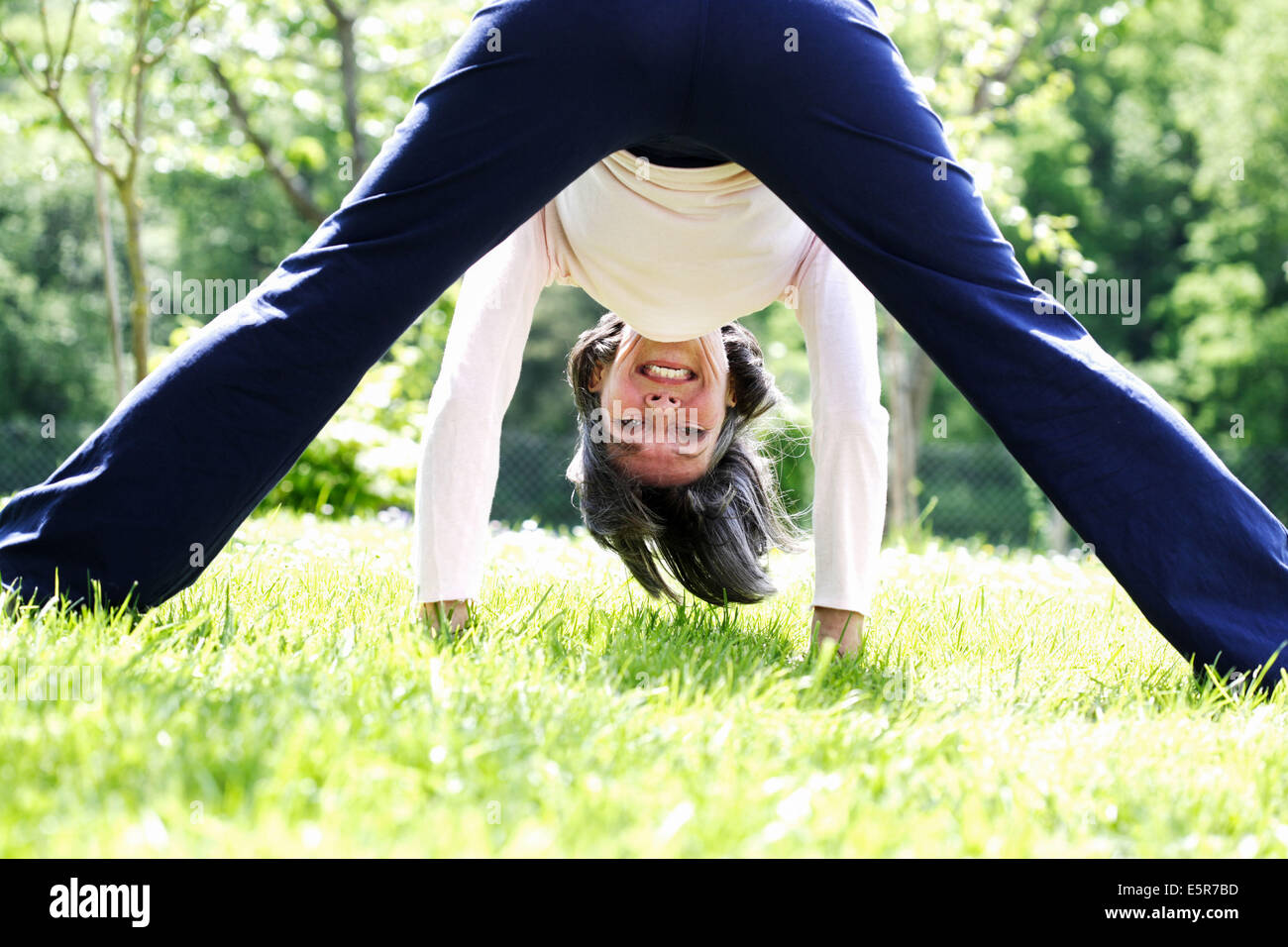60 year old woman stretching. Stock Photo