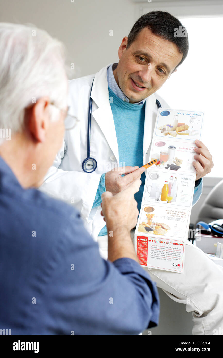 Senior patient receiving nutrition education from healthcare specialist during medical