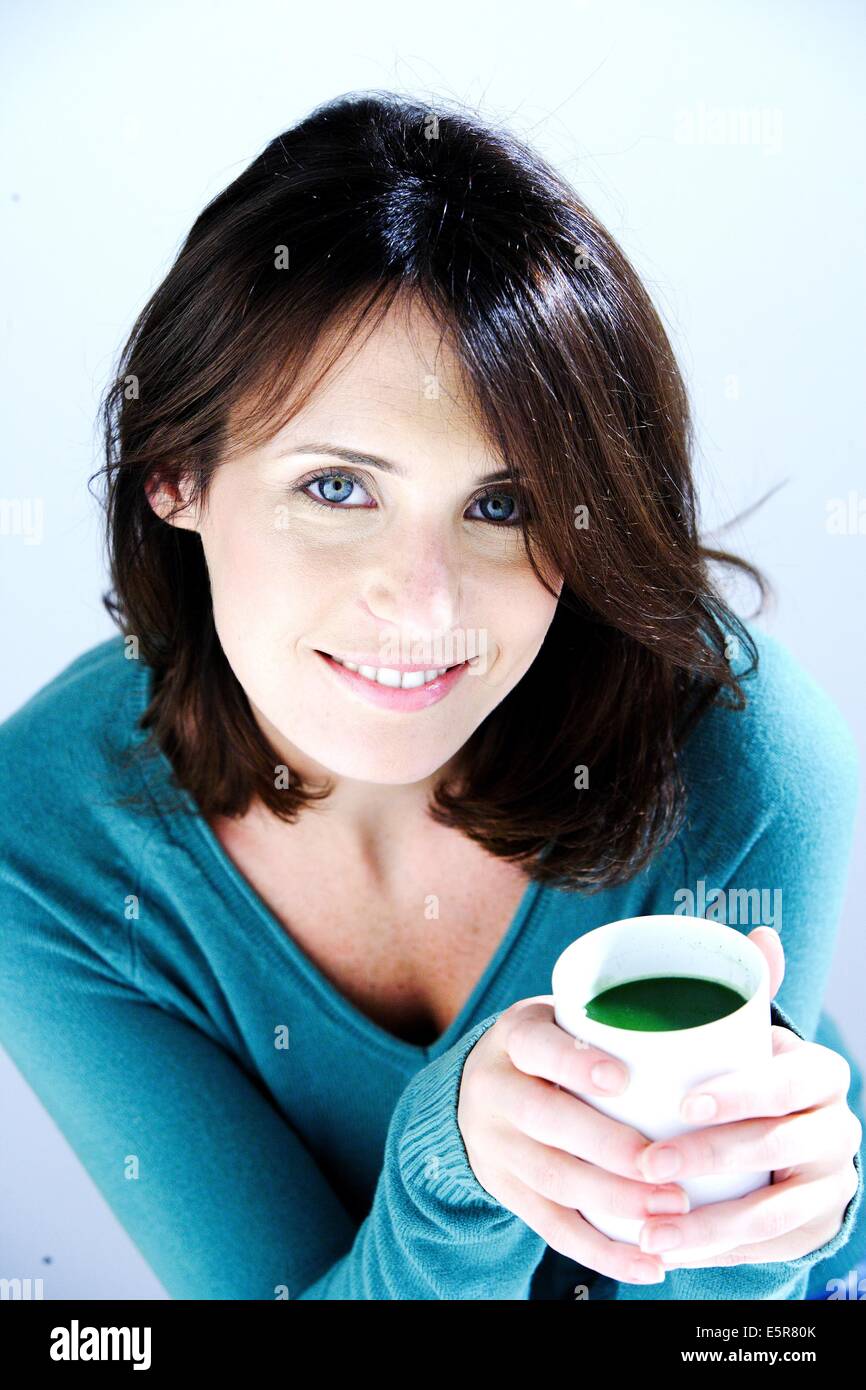 Woman drinking matcha, powdered Japanese green tea Stock Photo Alamy