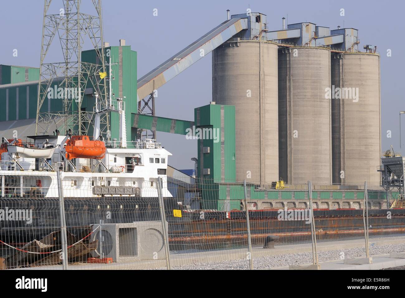 Venice, Italy, industrial Area of Porto Marghera, unloading of grain from a ship to silos of a mill Stock Photo