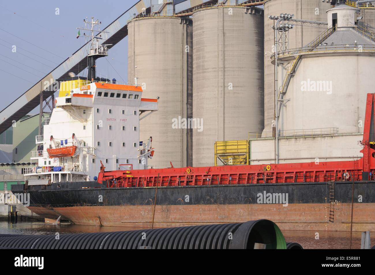Venice, Italy, industrial Area of Porto Marghera, unloading of grain from a ship to silos of a mill Stock Photo
