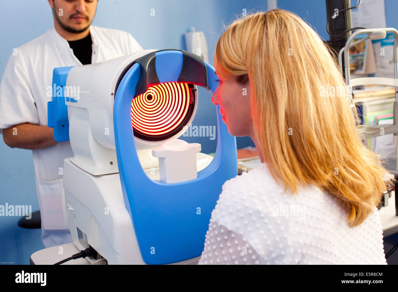 Screening and treatment of the keratoconus, Patient undergoing eye examination with the ORBSCAN