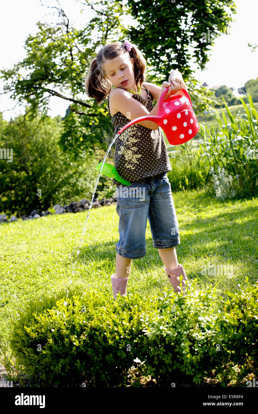 7 Year Old Girl Watering The Garden Stock Photo Alamy 7-year-old-girl-watering-the-garden-stock-photo-alamy