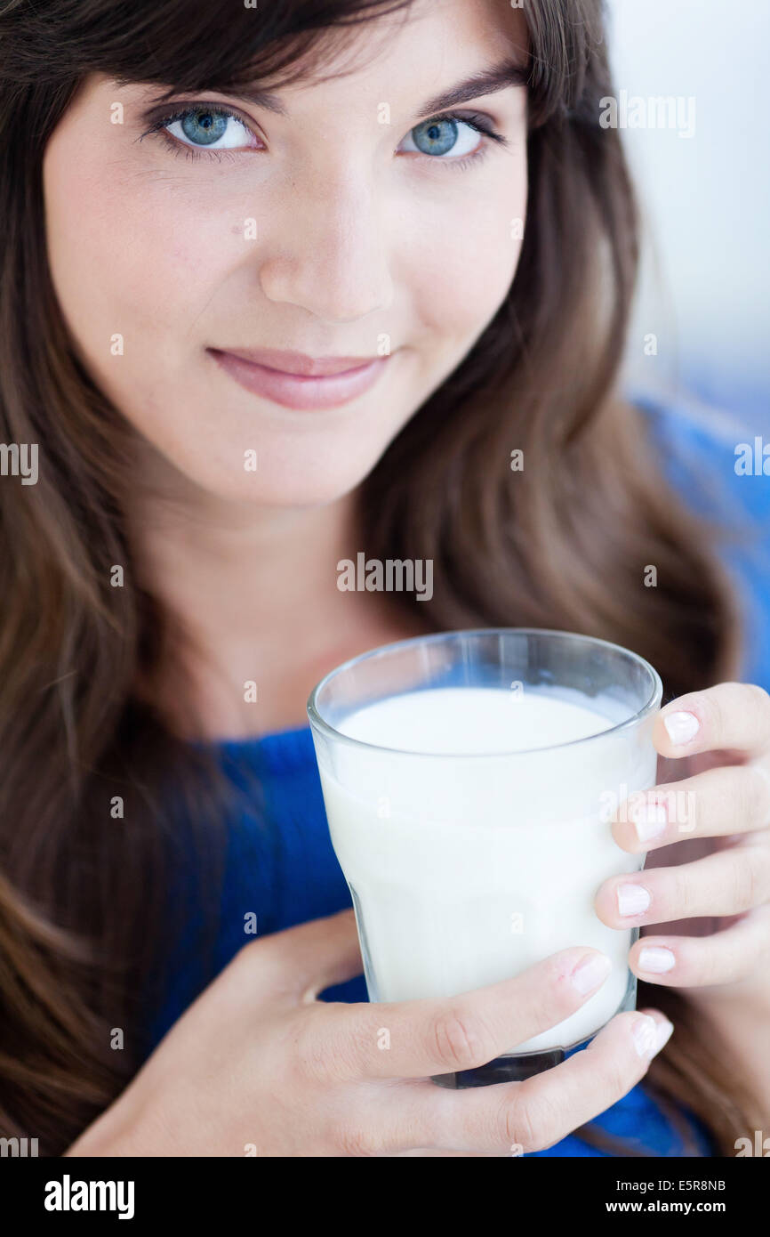 Woman drinking a glass of milk Stock Photo Alamy