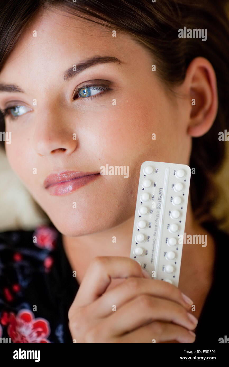 Woman with generic contraceptive pills. Stock Photo