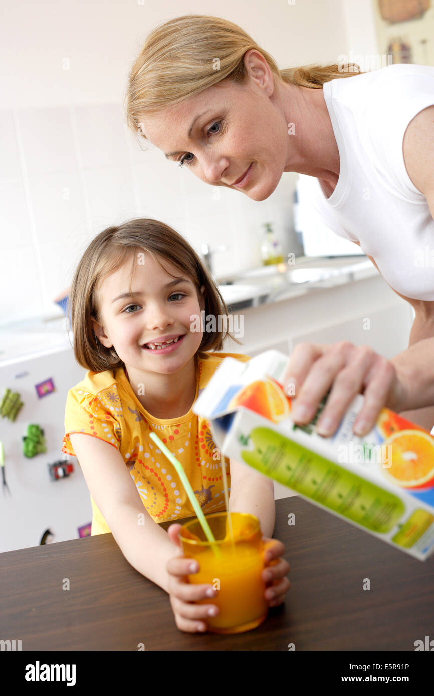Young girl drinking fruit juice Stock Photo Alamy
