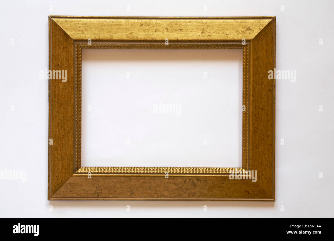 gold colour photo frame isolated on white background Stock Photo - Alamy