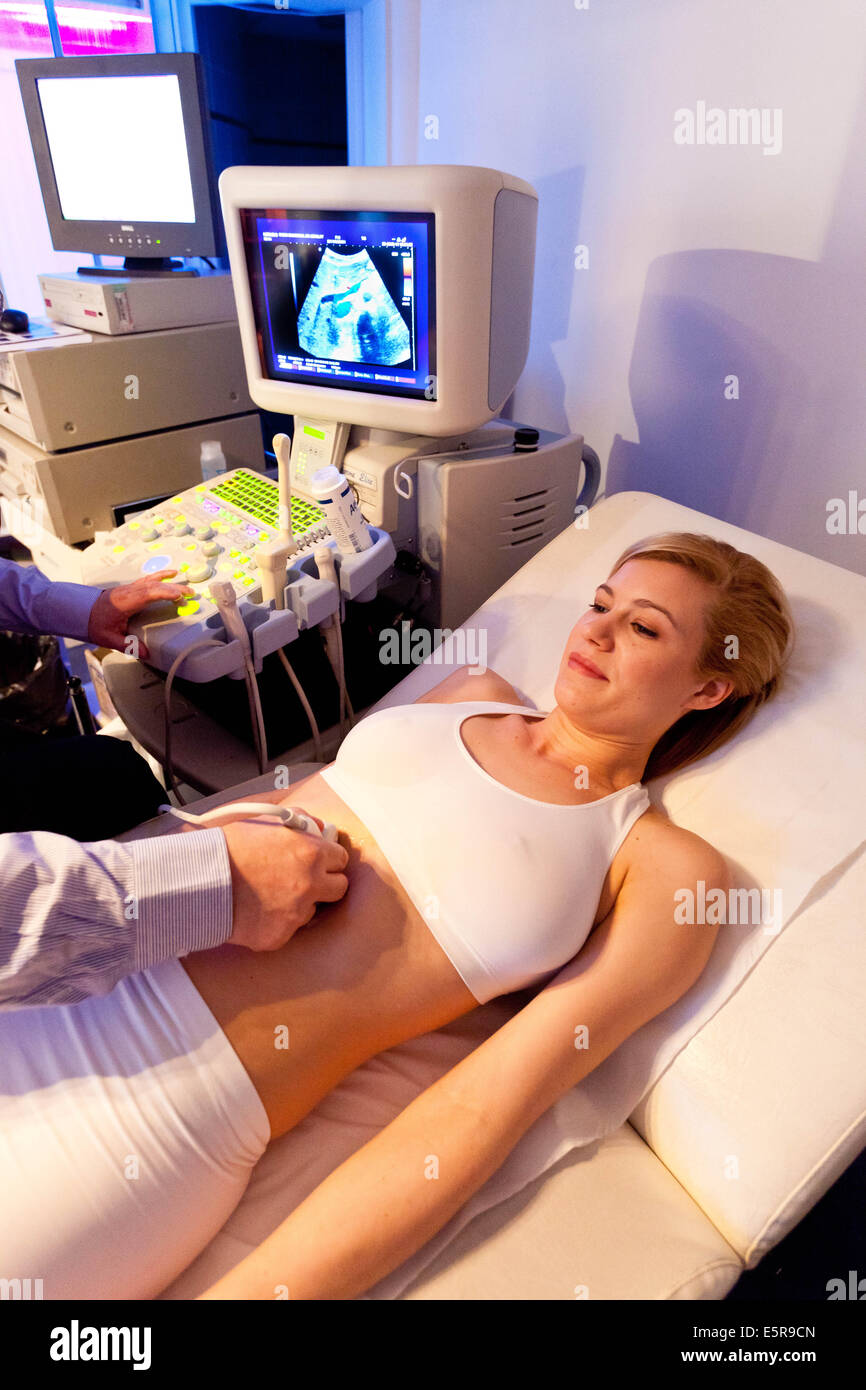 Woman undergoing abdominal ultrasound scan Stock Photo - Alamy