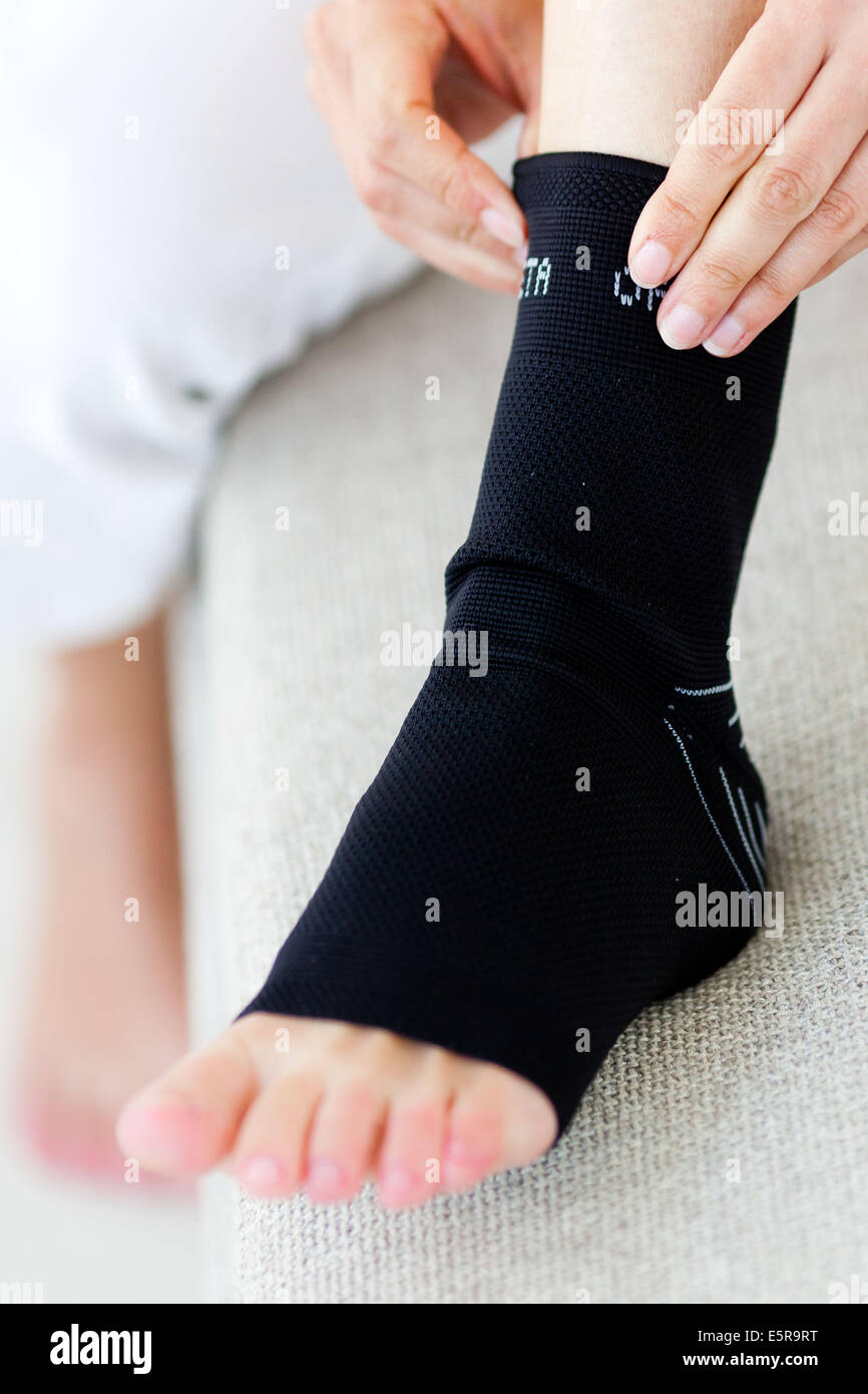 Woman wearing an ankle brace Stock Photo Alamy