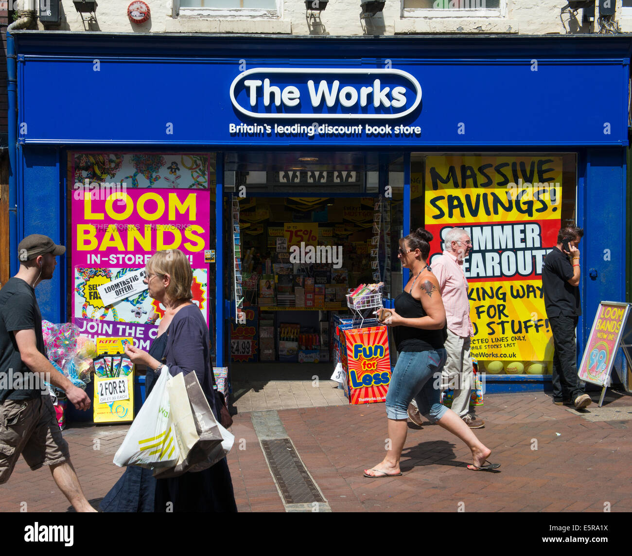 People walking past The Works shop in Shrewsbury, Shropshire, England, UK Stock Photo