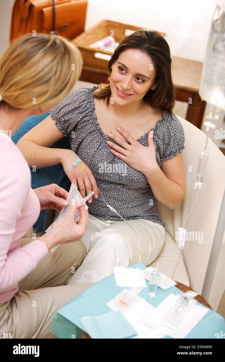 Patient in home medical care receiving chemotherapy. Stock Photo