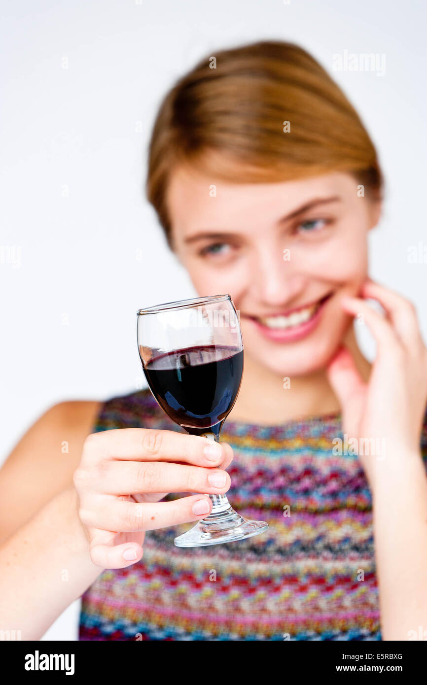 Woman drinking a glass of red wine. Stock Photo