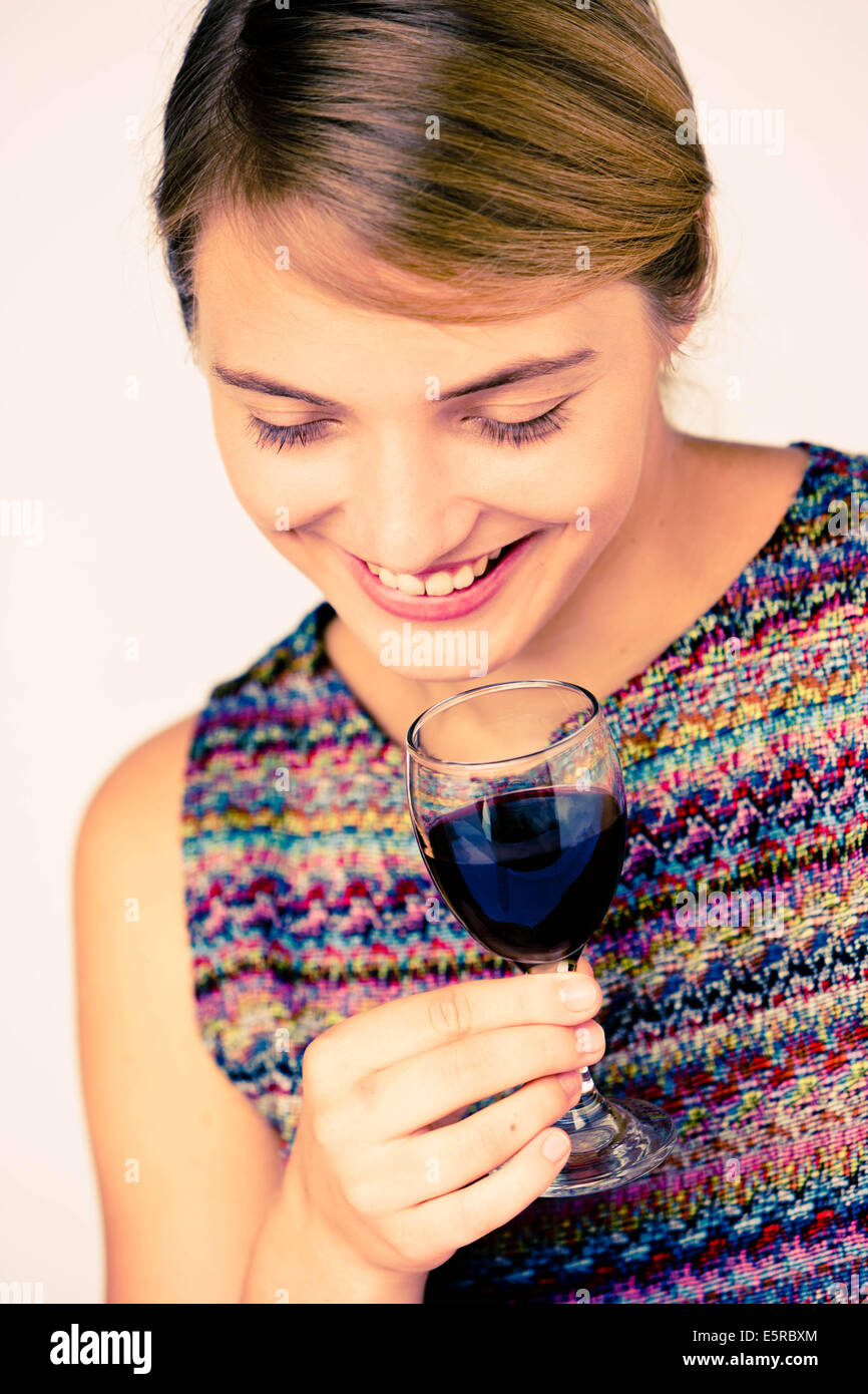 Woman drinking a glass of red wine Stock Photo - Alamy