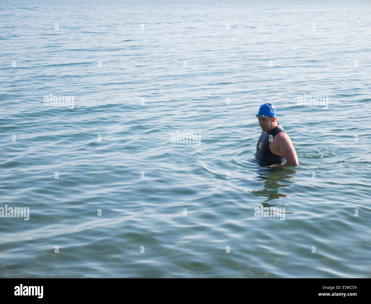 Fat man in water Stock Photo