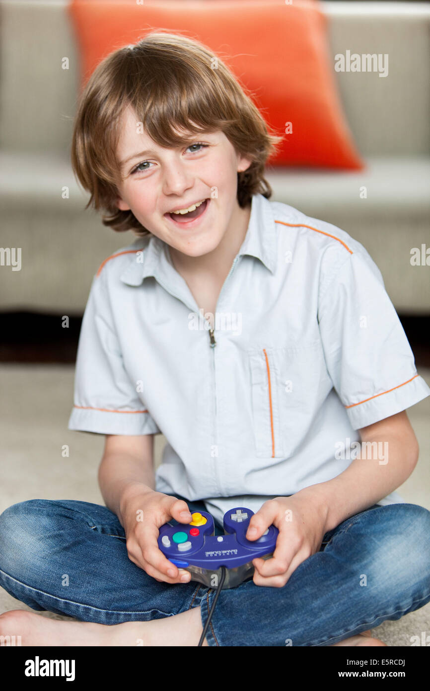 How long should a 7 year old play video games 9 Year Old Boy Playing Video Games Stock Photo Alamy