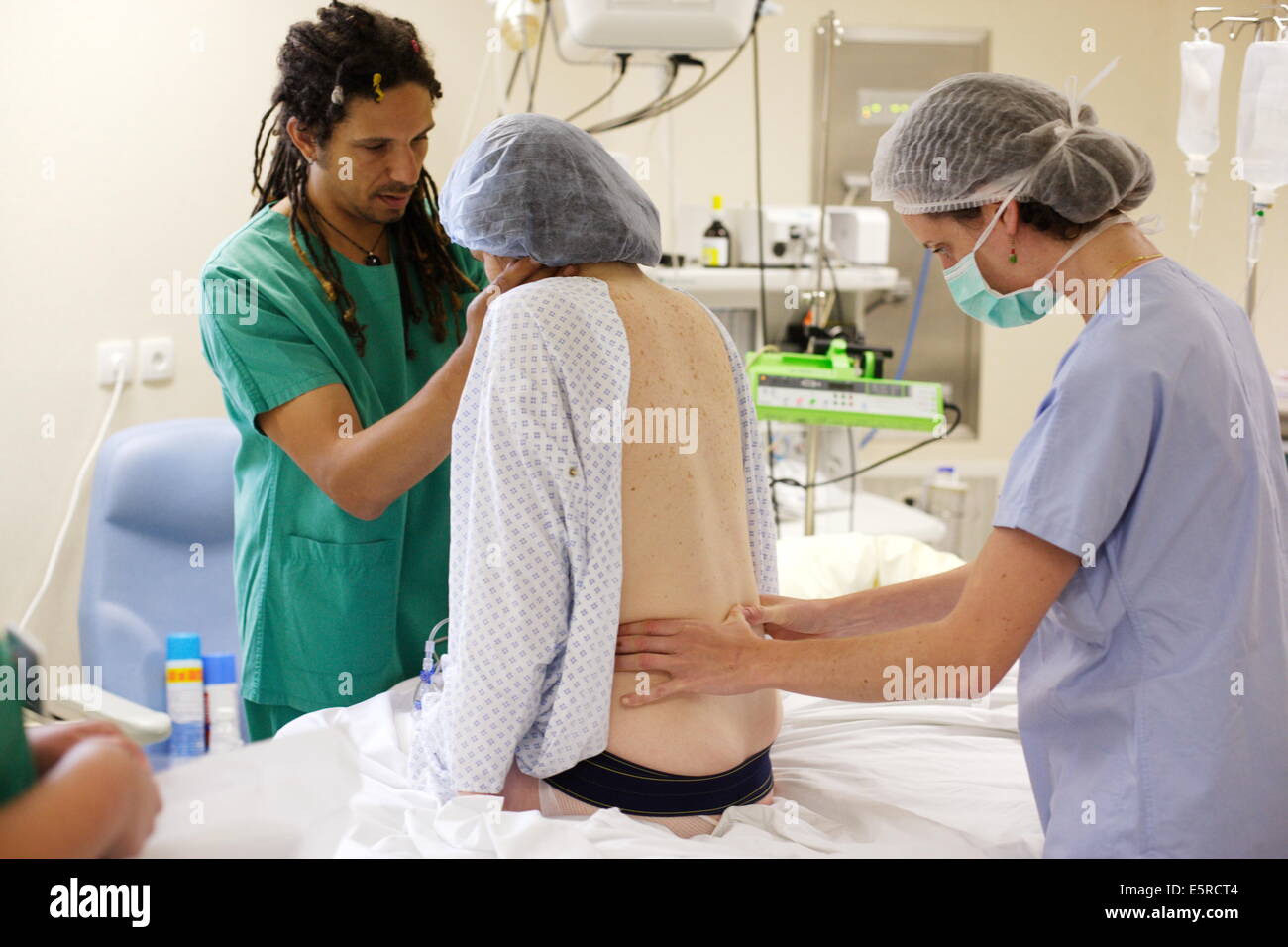Woman getting epidural anaesthetic injection prior to delivery
