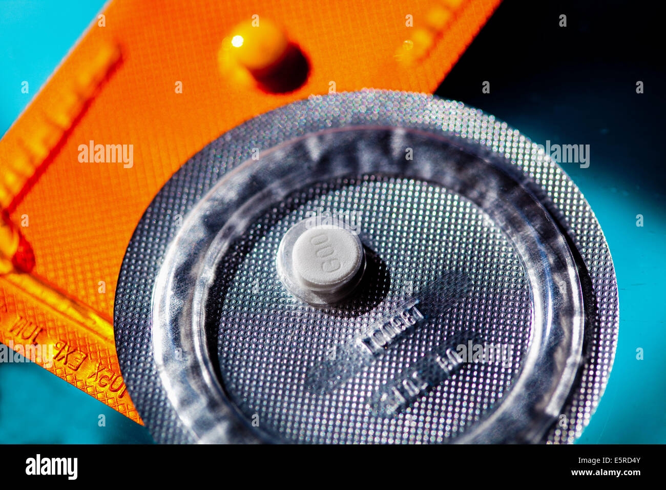 Generic morning-after pill, from Biogaran pharmaceutical (grey), and Norlevo non-generic morning-after pill (orange). Stock Photo