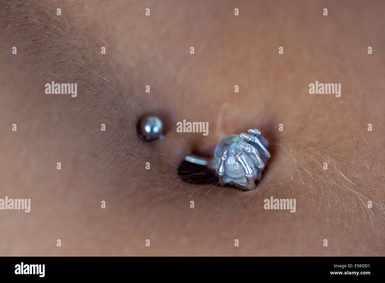 Close-up of a pierced navel. Stock Photo