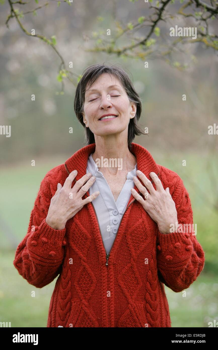 Senior woman doing zen breathing exercises outdoors Stock Photo Alamy