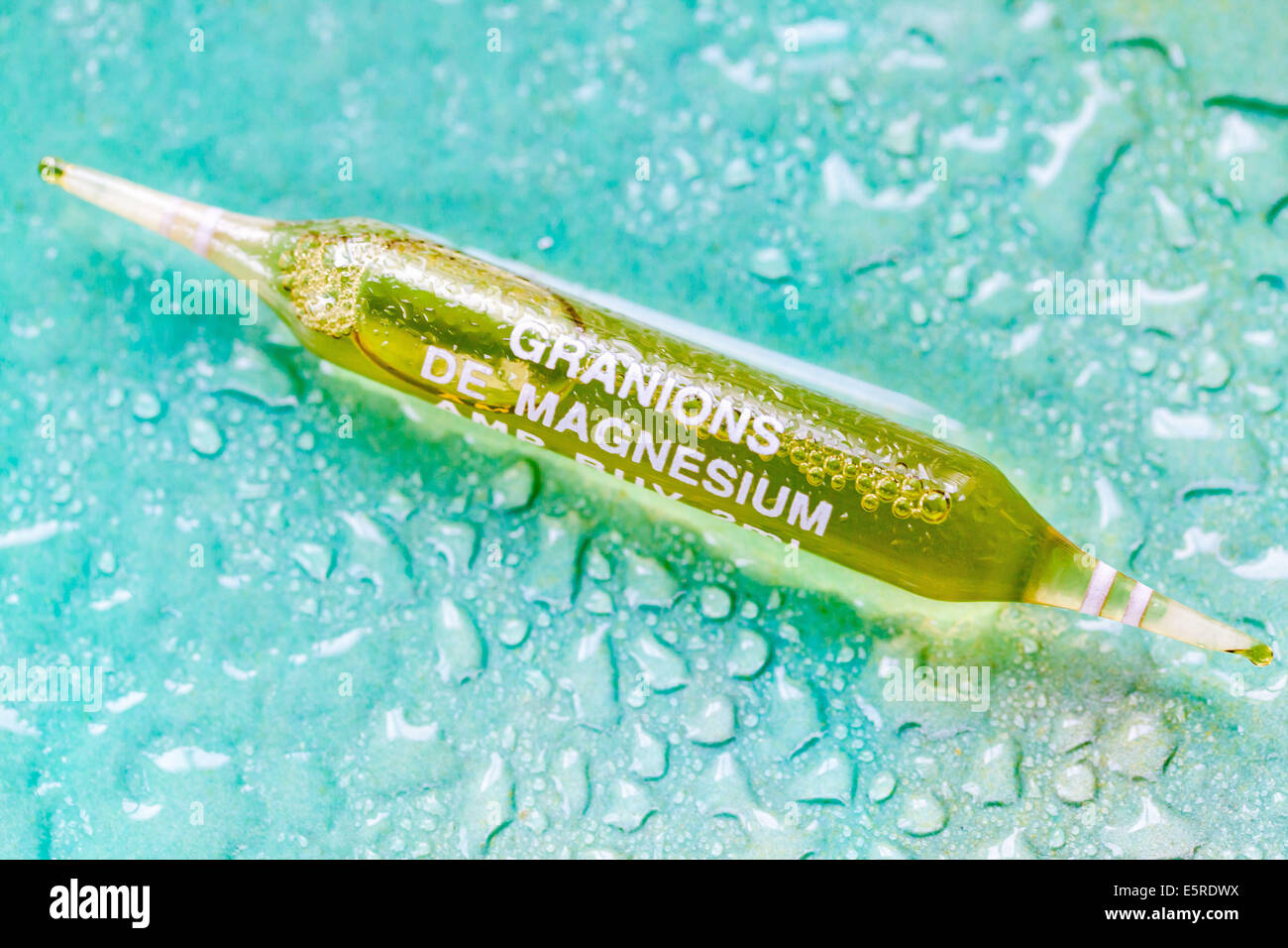 Glass ampoule of magnesium. Stock Photo