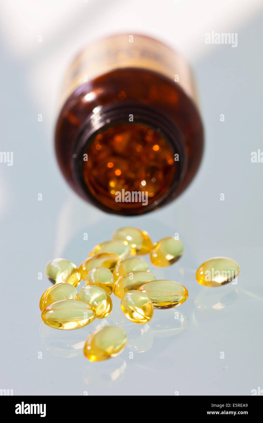 Fish oil gelatine capsule and vitamin Stock Photo Alamy