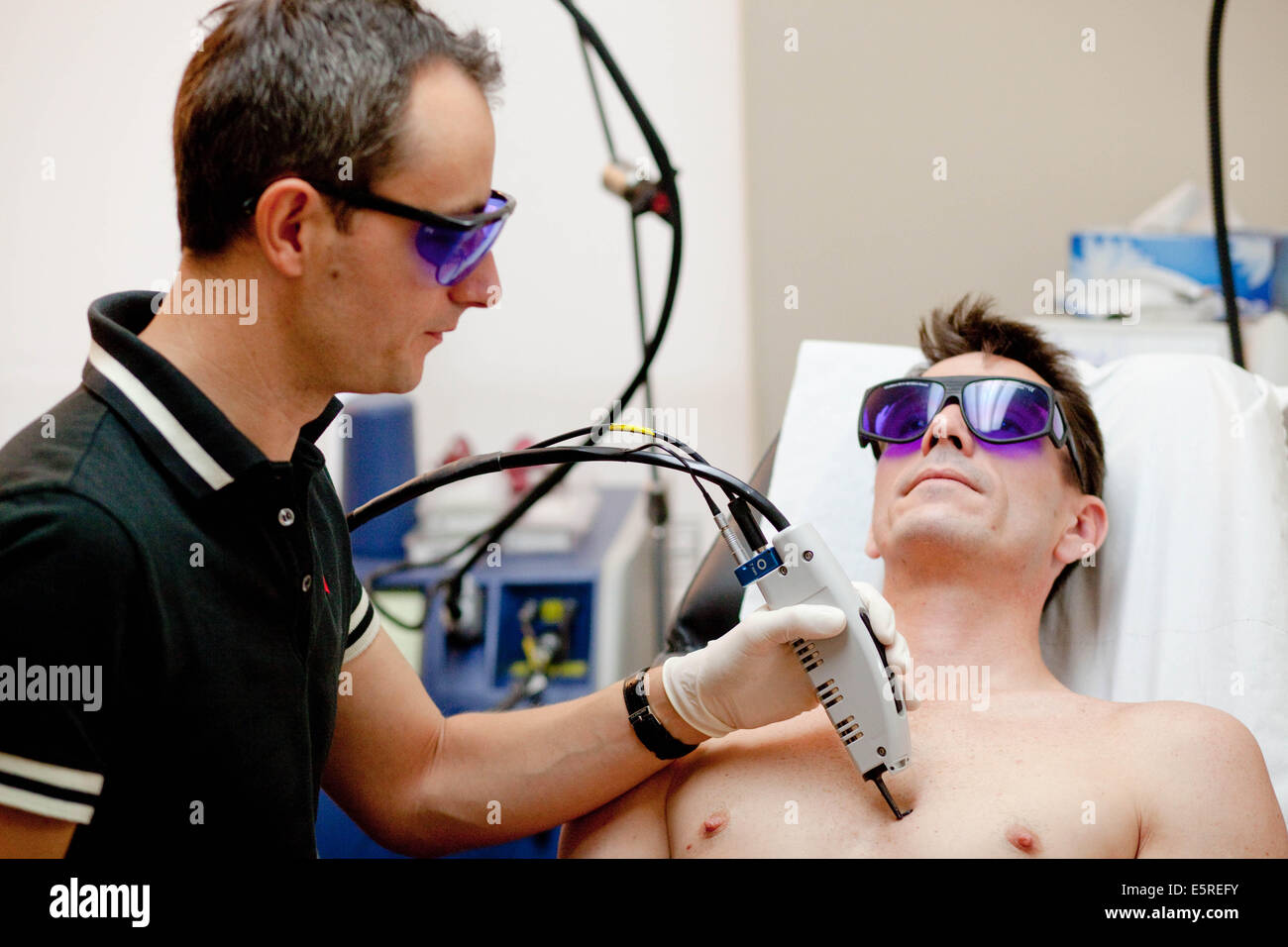 Man undergoing KTP laser treatment, Pulsed dye KTP laser used in treatment  of rosacea and varicosity by reducing the diameter Stock Photo - Alamy