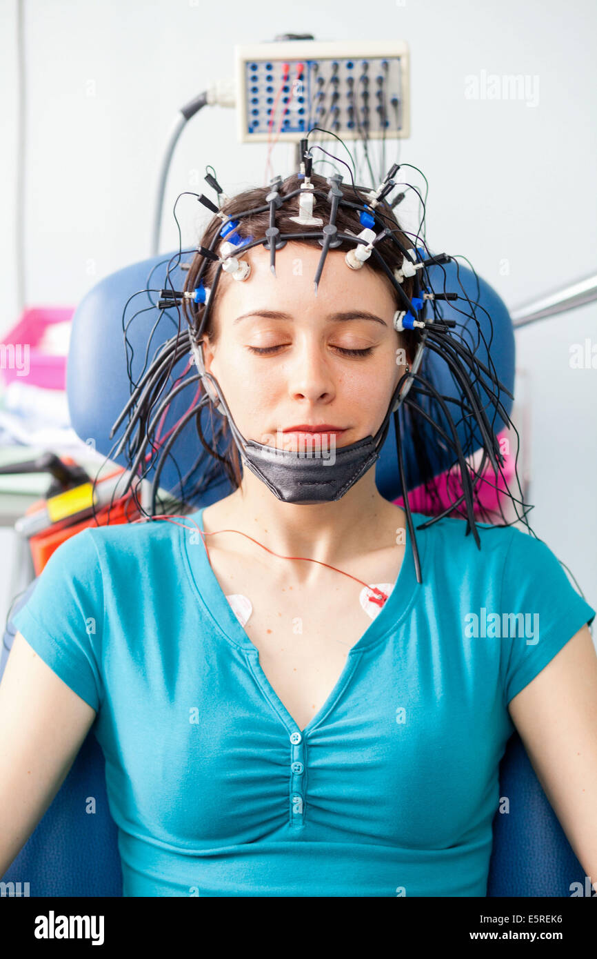 Woman undergoing an electroencephalogram (EEG), Limoges hospital