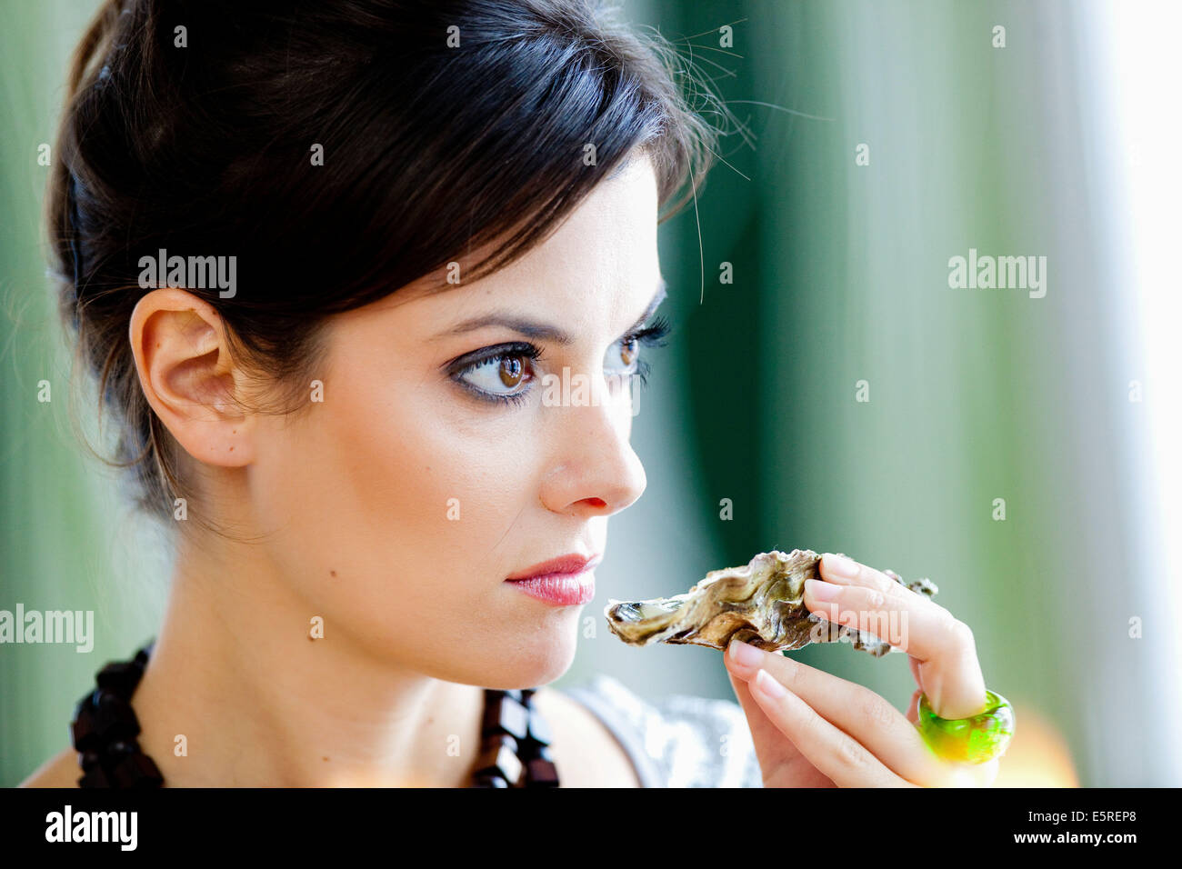 Woman smelling a rotten oyster Stock Photo Alamy