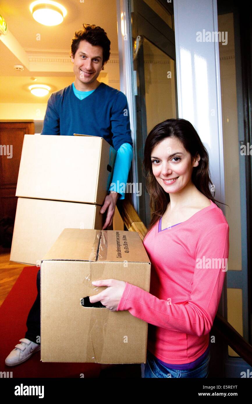 Couple moving into new home Stock Photo - Alamy