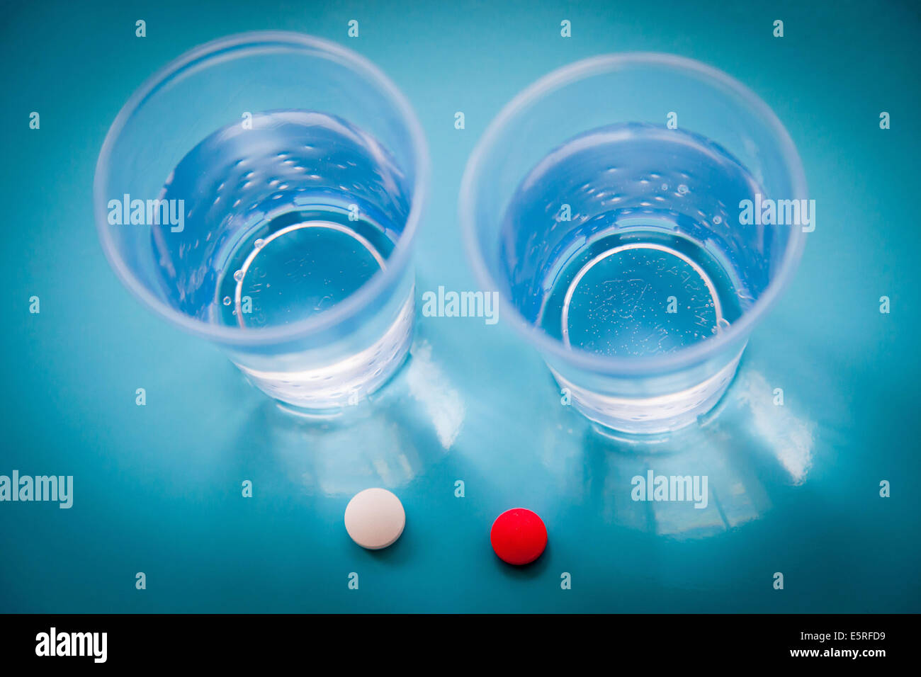 Tablets ans glasses of water. Stock Photo
