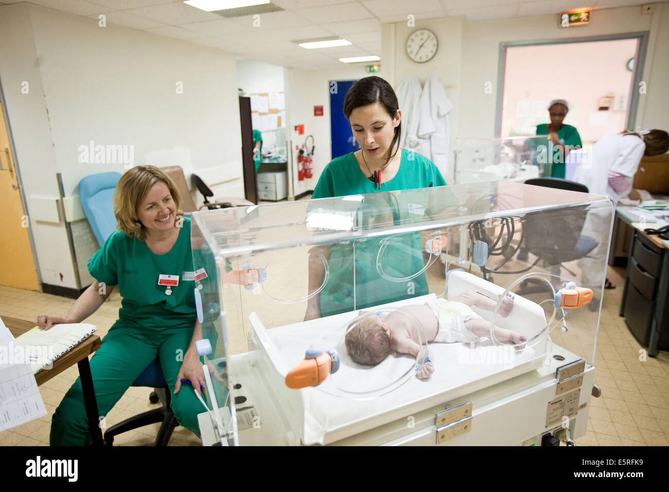 Midwives And A Newborn Baby In An Incubator, Maternity Department ...