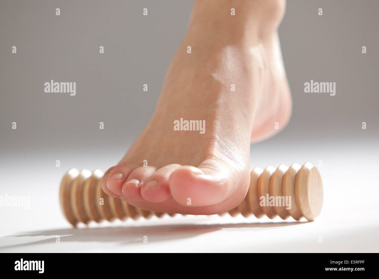 Woman using a massage machine Stock Photo Alamy